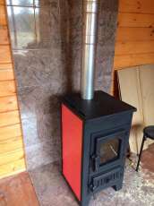 Купить стальной камин Везувий ПК-01 (270) в Новополоцке фото в интерьере в Новополоцке