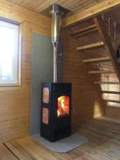 Популярный камин с дровницей Сибирь 8 в интерьере фото в Новополоцке