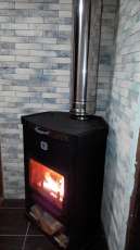 Стальной недорогой камин Теплодар ОВ-120 (угловой) фото в интерьере в Новополоцке