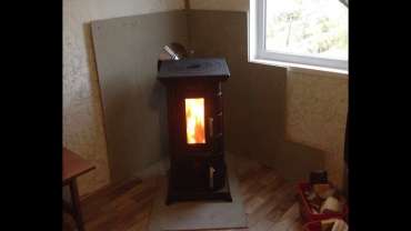 Отопительная печь Термофор Статика Тетра, чёрная бронза фото в интерьере в Новополоцке