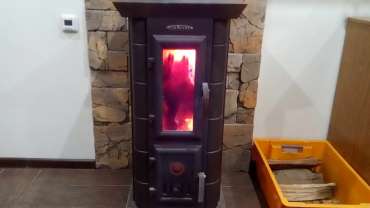 Стальная печь Термофор Статика Тетра, чёрная бронза фото в интерьере в Новополоцке