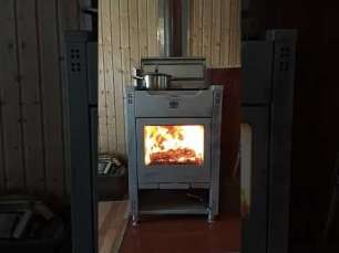 Стальной камин со стеклом Теплодар Кадриль фото в интерьере в Новополоцке