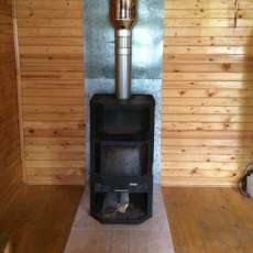 Печь-камин с шамотом Мета-Бел Ангара-Аква в интерьере фото в Новополоцке