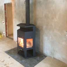 Купить недорогой камин с шамотом Мета-Бел Енисей в Новополоцке фото в интерьере в Новополоцке