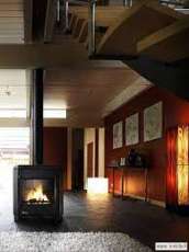 Печь-камин чугунный Invicta Carolo в интерьере Амазонка бай фото  в Новополоцке