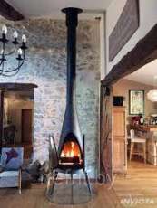 Печь-камин чугунный Invicta Pow-Wow в интерьере Амазонка бай фото в Новополоцке